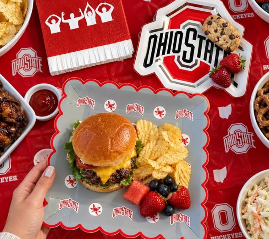 Ohio State Buckeyes party table with scarlet and gray foil-accent plates, napkins, and tablecloth
