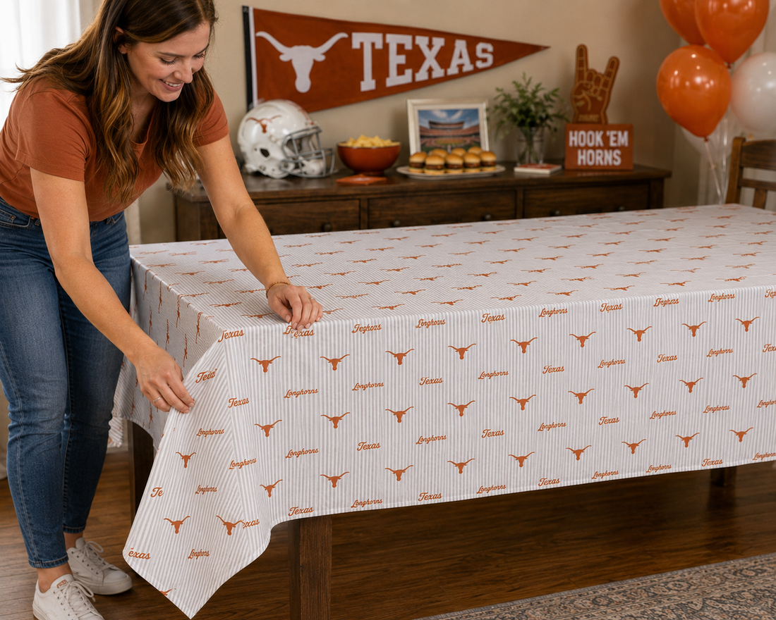Texas Longhorns disposable plastic tablecloth, 9 by 4.5 feet, with burnt orange and white logo print